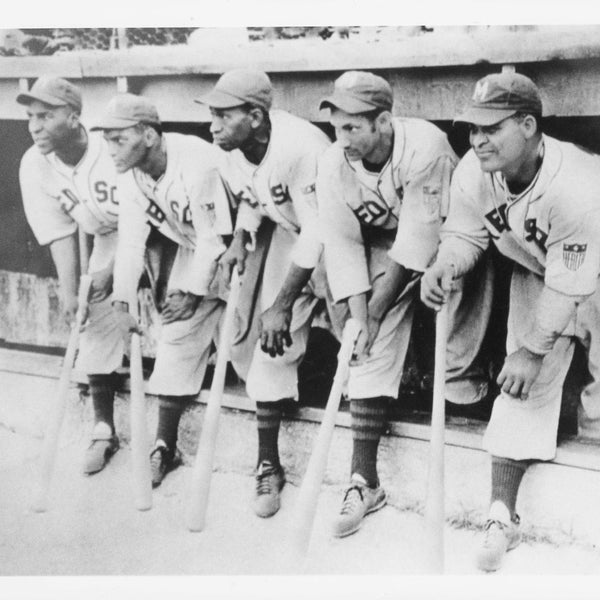 The Memphis Red Sox were proud to call Martin's Stadium home. It was operated by Memphis' Martin Brothers, and was one of the few ballparks in America owned by African Americans.Left to right we see Neil Robinson, Bubba Hyde, Nat Rogers, McDaniels, Wayman "Red" Longley in the dugout.