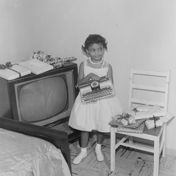 Withers loved capturing everyday life, especially families and children. This young girl with her typewriter is another example of highlighting the simple joys found in Black homes despite the challenges of the time period.