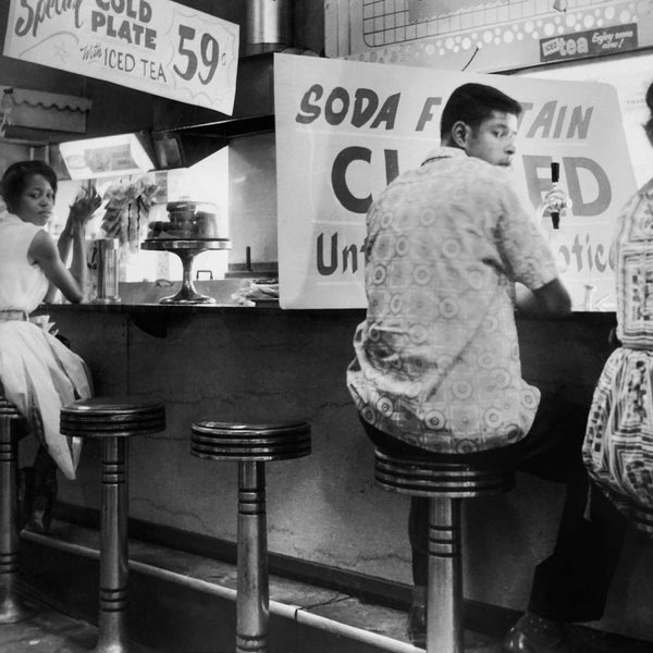 Students Pamela Caldwell and Lloyd Hall joined hundreds of others in peaceful sit-ins at Whites Only lunch counters across the South. They were spat on, cursed at, and had hot coffee poured on them — but never moved. Their courage taught America that dignity cannot be denied to those who refuse to surrender it.