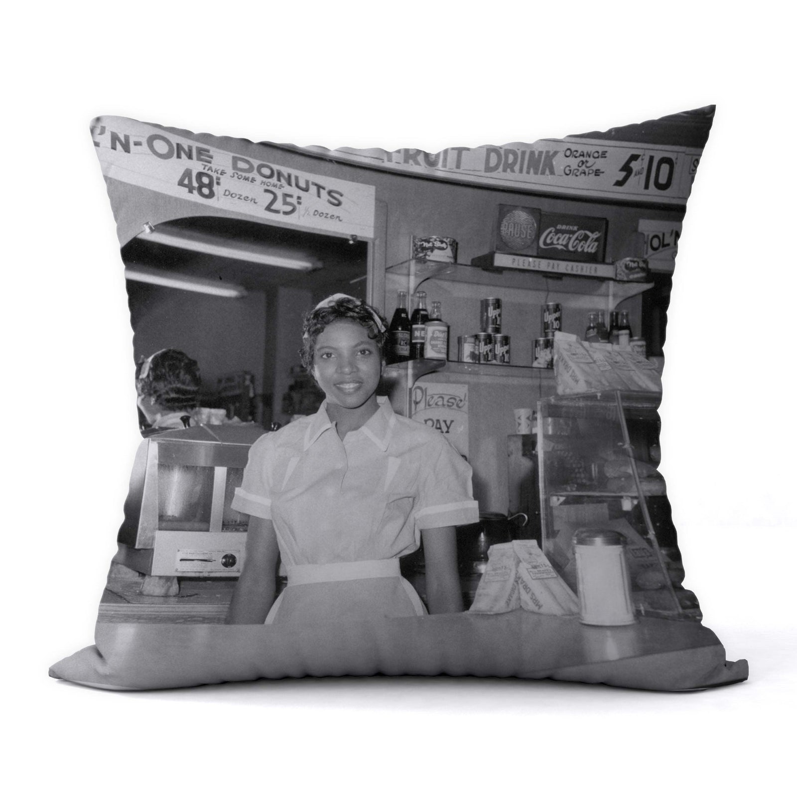 This 1950s photo captures Helen Ann Smith as she poses at the counter of the Harlem House diner, a restaurant chain based ...